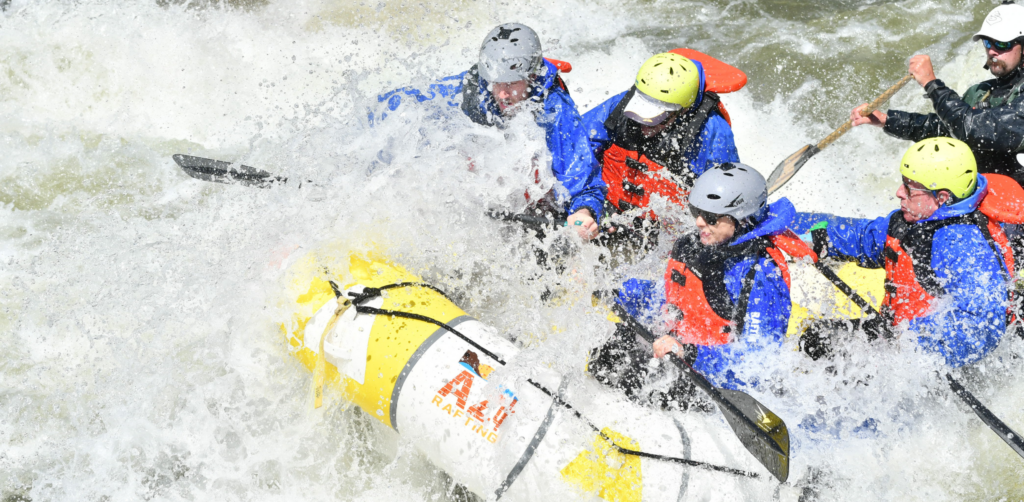 A yellow raft on Arizona's Salt River navigates white water rapids