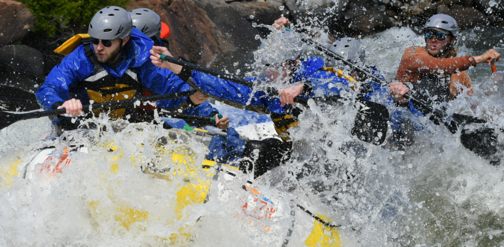 People in a yellow raft navigate rapids on Arizona's salt river