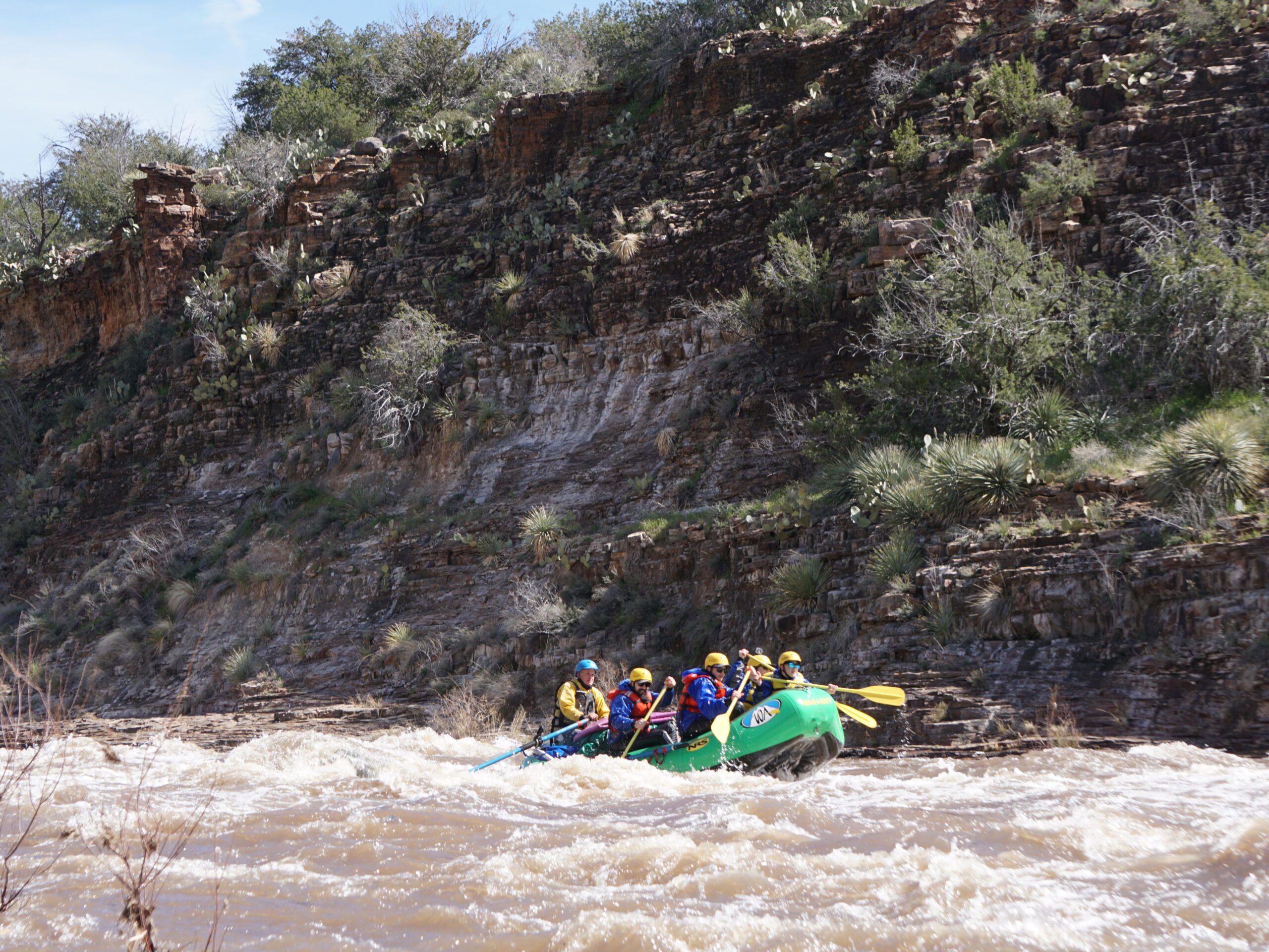 A green raft rows down the salt river in arizona
