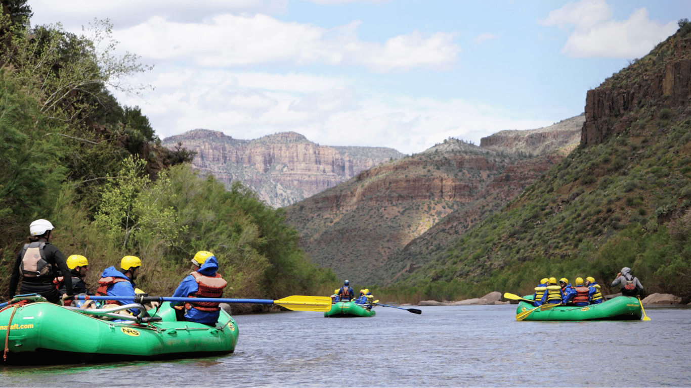 Rafters floating down the deep canyon walls of the salt river.