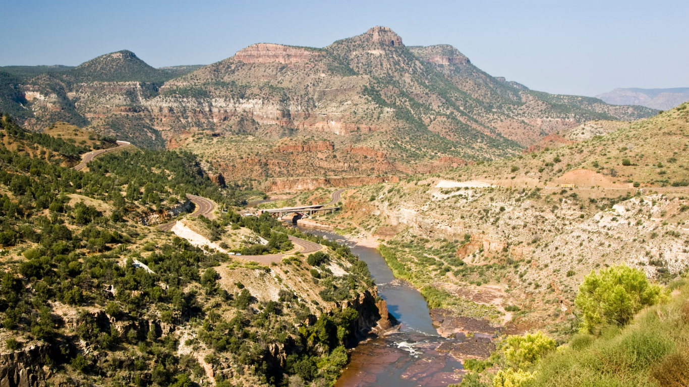 canyon wall rising above the salt river to show the many layers of rock